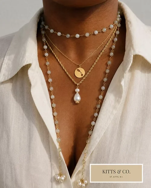 Layered pearl and coin necklaces