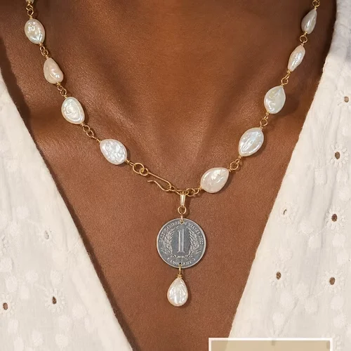Pearl and coin necklace worn on skin